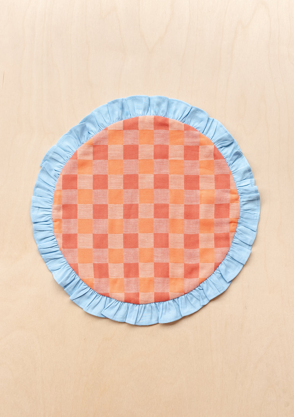 TBCo Cotton Placemats Set of 2 featuring apricot checkerboard pattern and blue ruffle trim in circular design