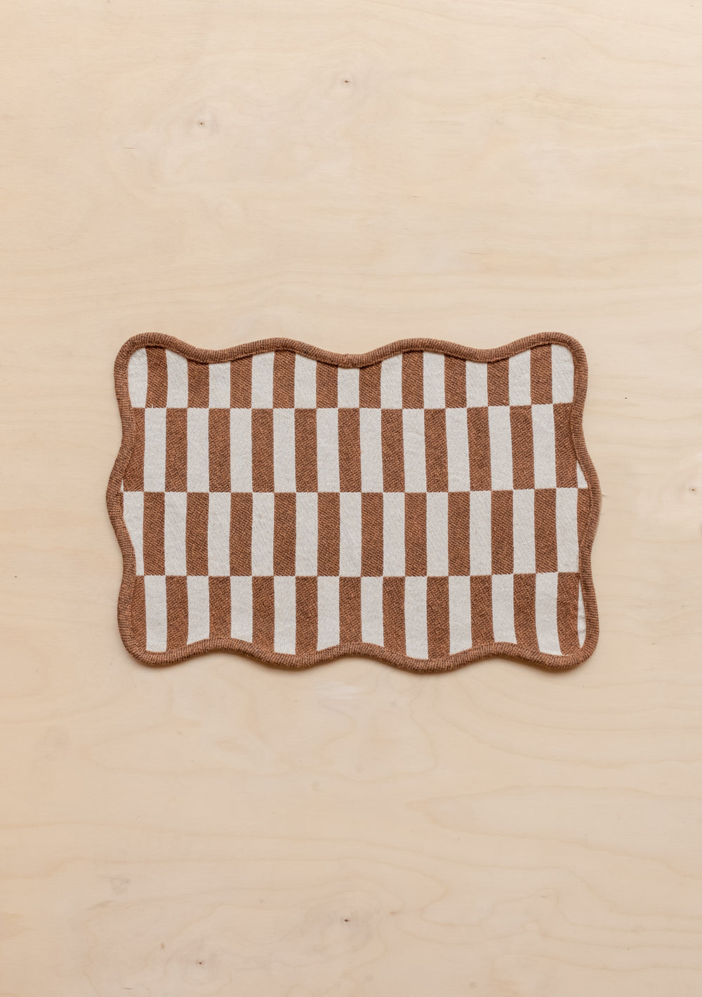 TBCo Cotton Placemat in Camel Checkerboard pattern with scalloped edges and contrast piping, displayed on cream background