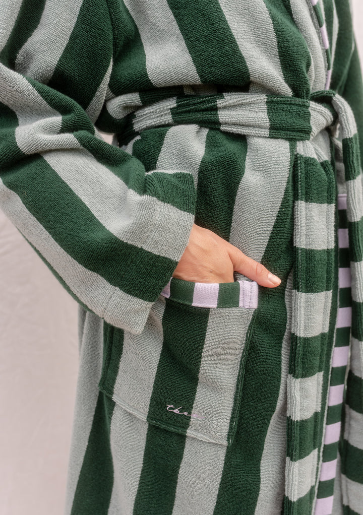 Close-up of TBCo Cotton Bath Robe in Green Stripe showing plush fabric, pocket, sash, and textured stripe details.