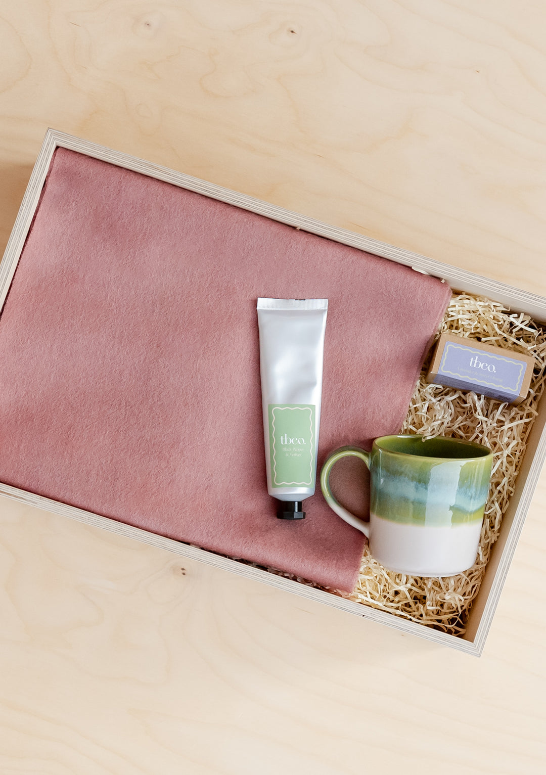 TBCo Ready-Made Gift Box For Her featuring pink lambswool scarf, hand cream, green ceramic mug in sustainable presentation box