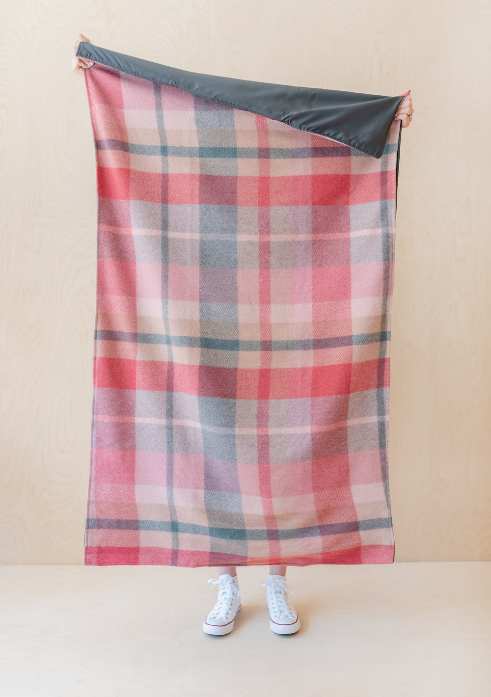 TBCo recycled wool picnic blanket in pink and grey check pattern with water-resistant backing, displayed unfolded