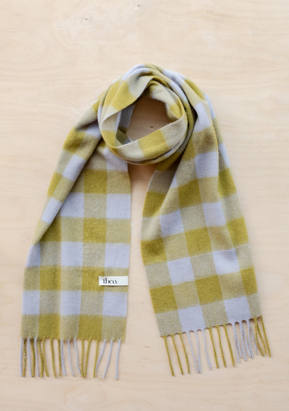 TBCo Lambswool Scarf in Avocado Gingham displayed flat showing green and white checkered pattern with fringed ends