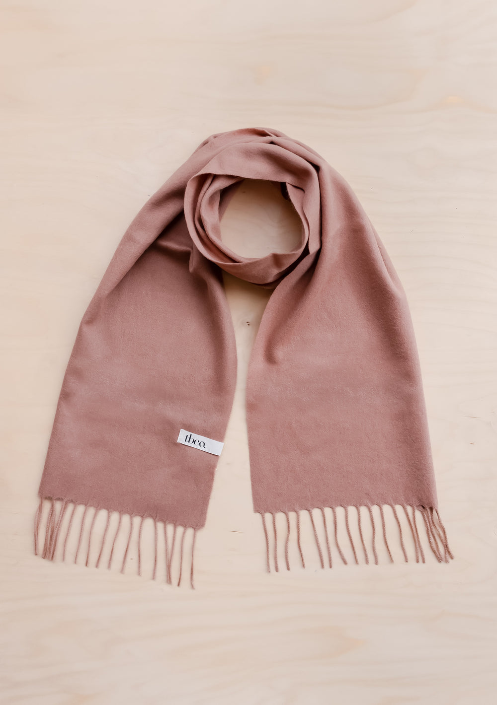 TBCo Ready-Made Gift Box For Her featuring a blush pink lambswool scarf with elegant fringe detail on beige background