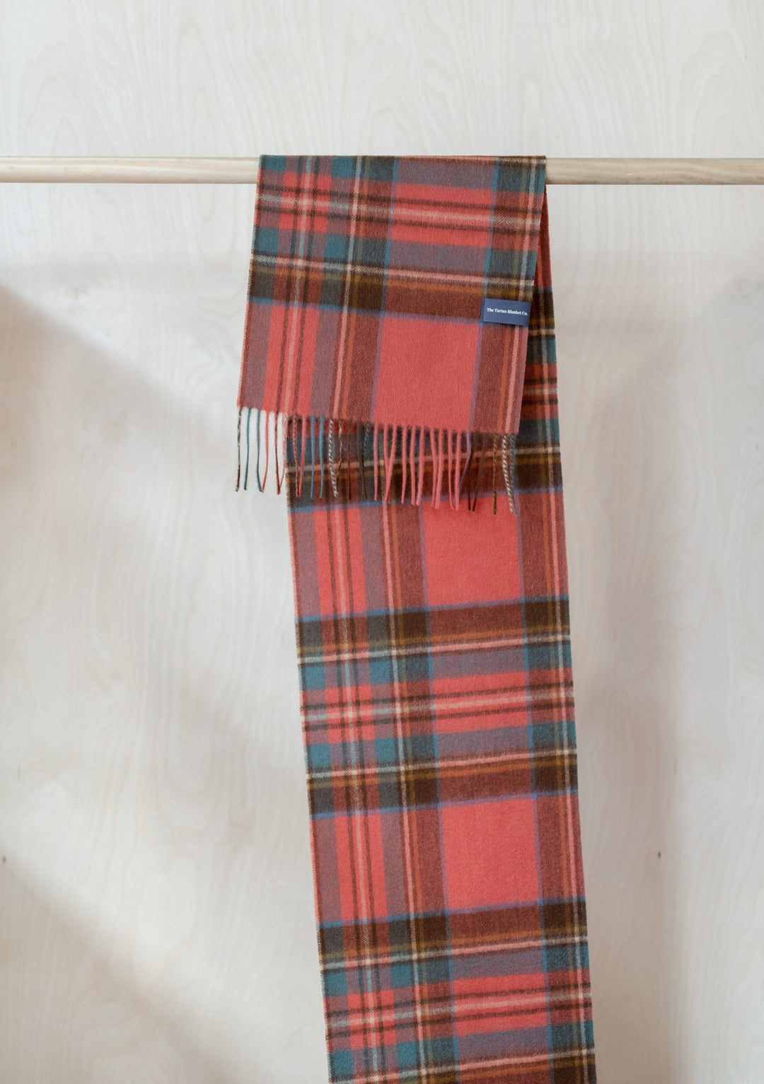 TBCo Lambswool Scarf in Stewart Royal Antique Tartan featuring traditional plaid pattern in coral, blue and brown with fringed ends