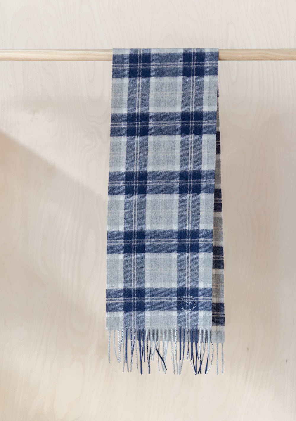 TBCo Kids Lambswool Scarf in Bannockbane Silver Tartan featuring blue and grey plaid pattern with fringed ends, displayed hanging