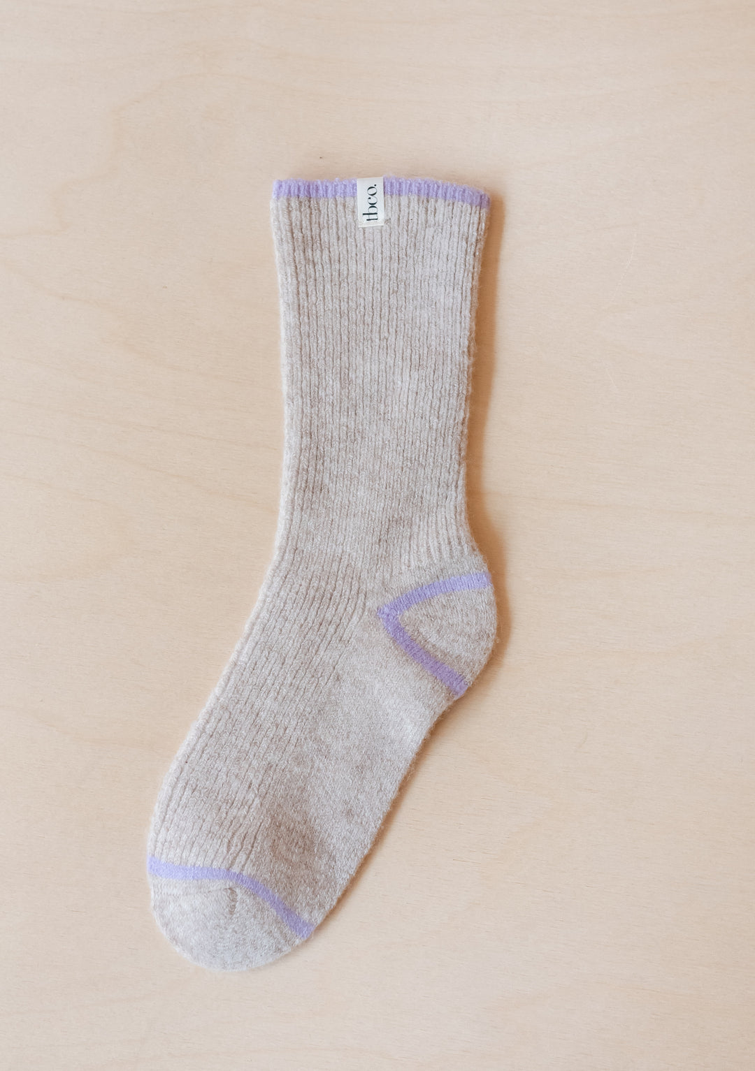 TBCo Cashmere & Merino Tipped Socks in oatmeal colour with lavender accents on heel, toe and cuff displayed on beige background