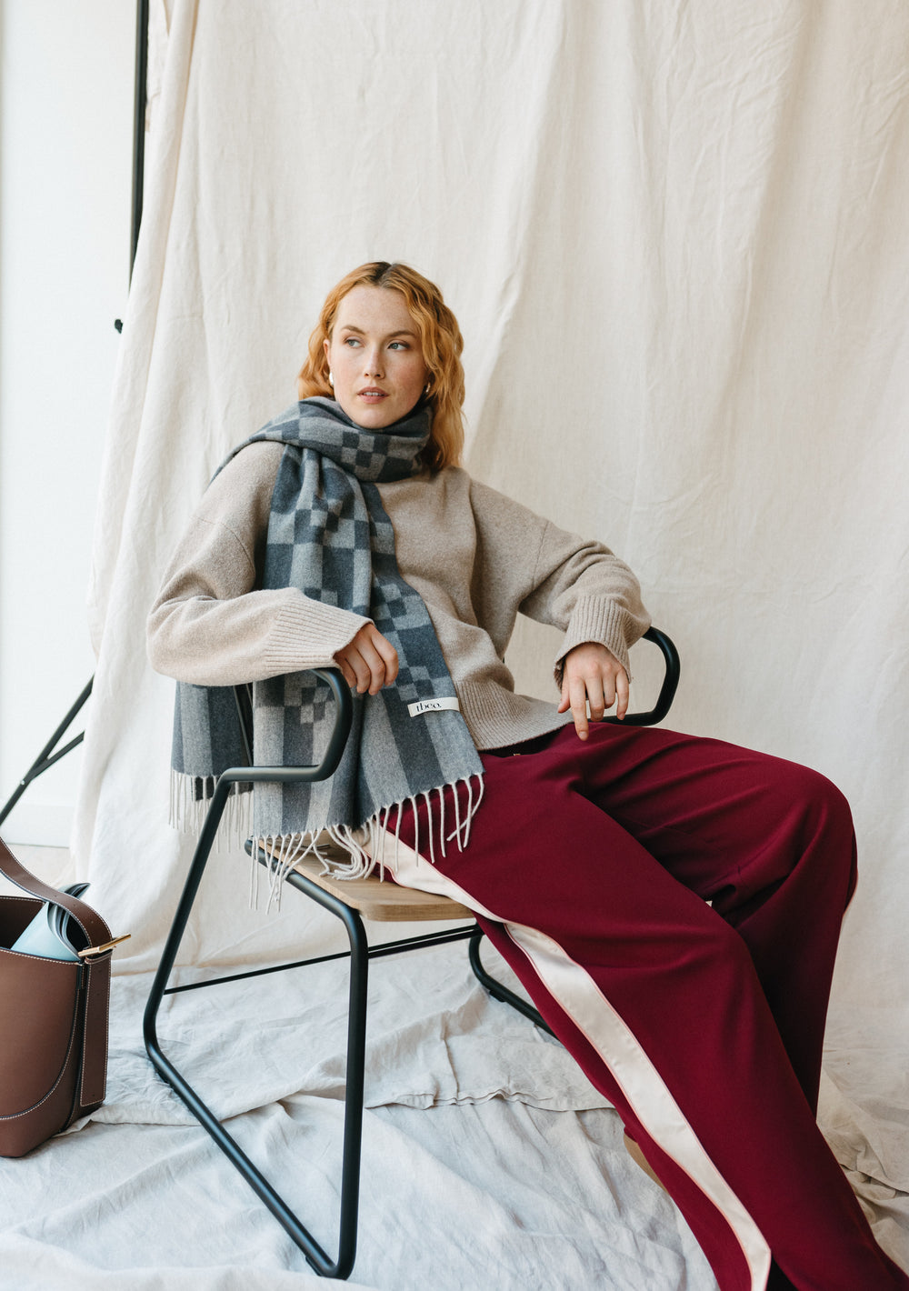 TBCo oversized cashmere and merino wool scarf in charcoal grey with geometric block pattern and fringed edges