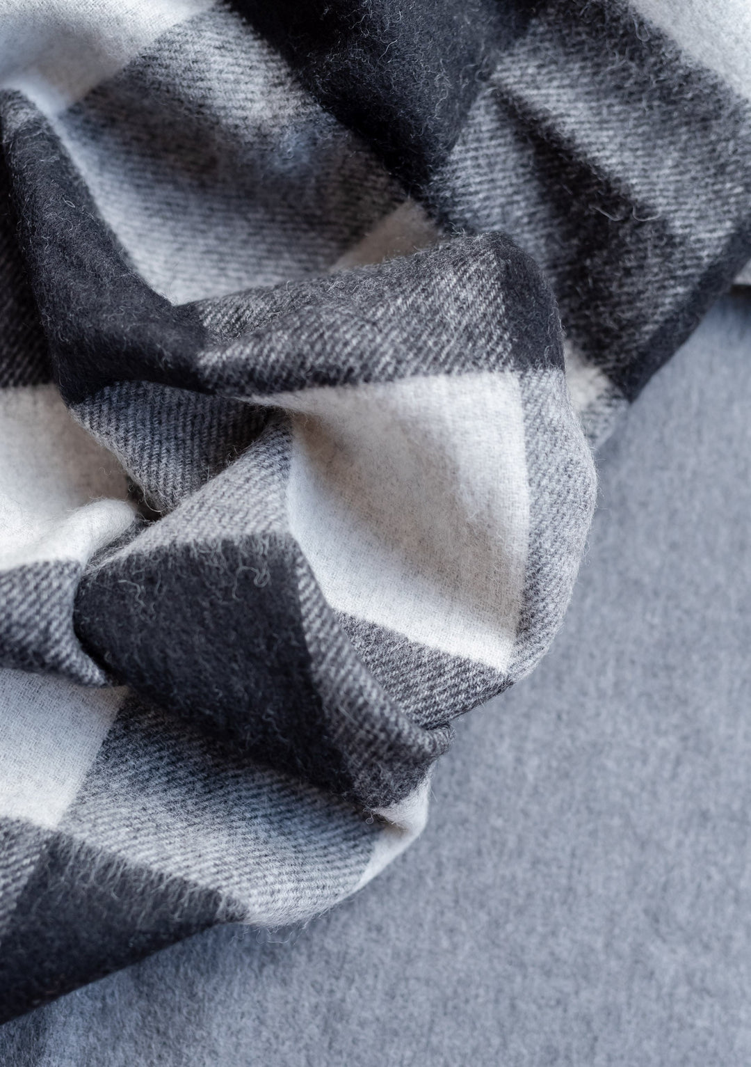 TBCo x Amy Bell Spencer 2.0 lambswool scarf featuring monochrome check pattern with charcoal grey reverse side