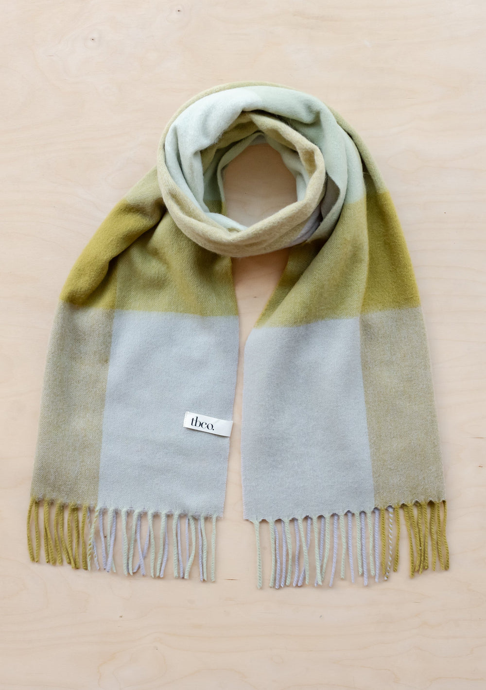 TBCo Lambswool Oversized Scarf in Sage Block Check featuring soft green and grey colour blocks with fringed edges