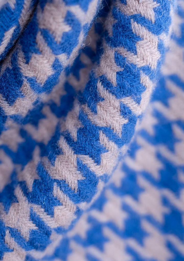 Close-up detail of TBCo's Lambswool Oversized Scarf in Slate Houndstooth pattern showing blue and grey woven texture