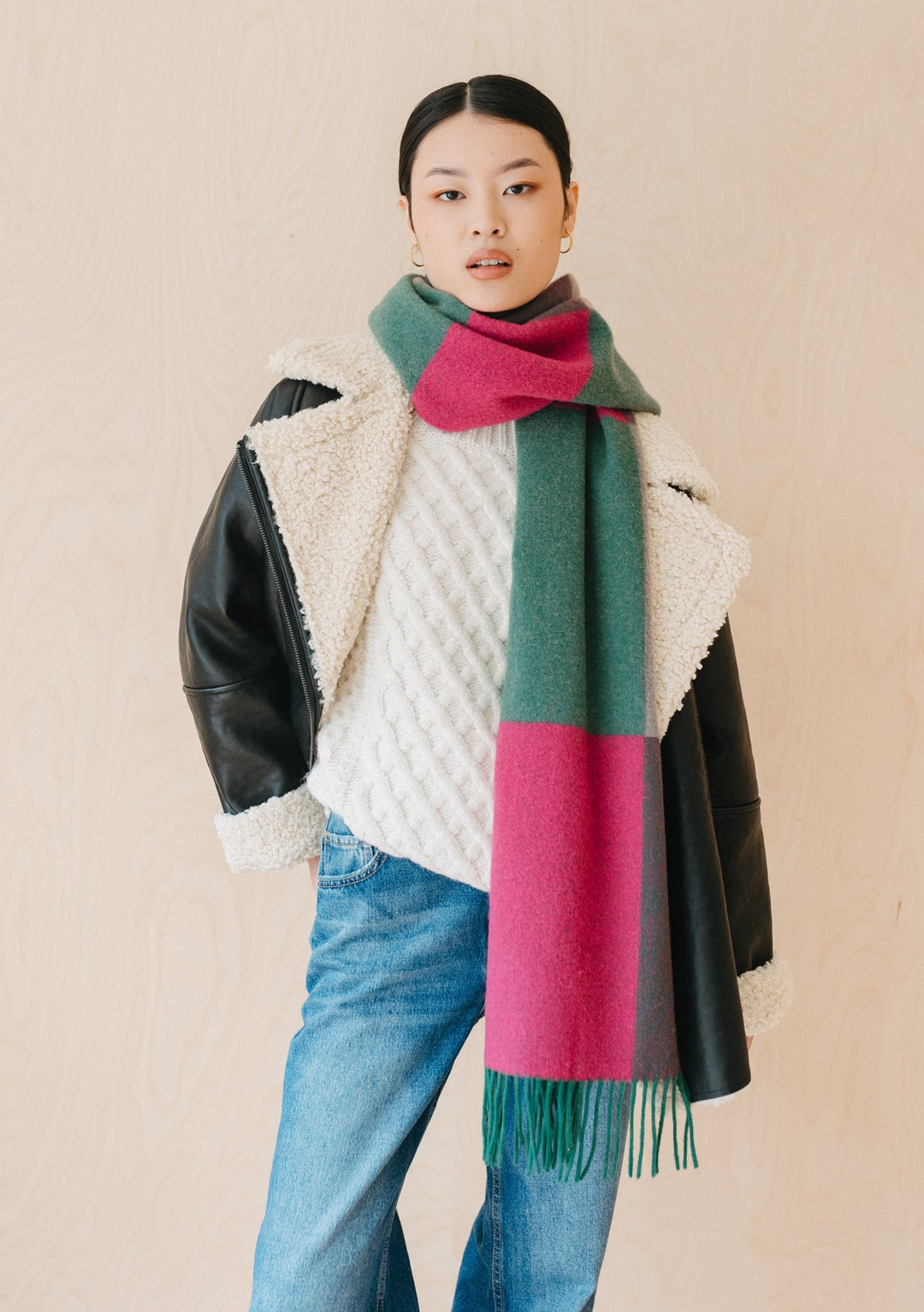 TBCo lambswool oversized block jacquard scarf in green and fuchsia with fringe detail, styled with winter outfit
