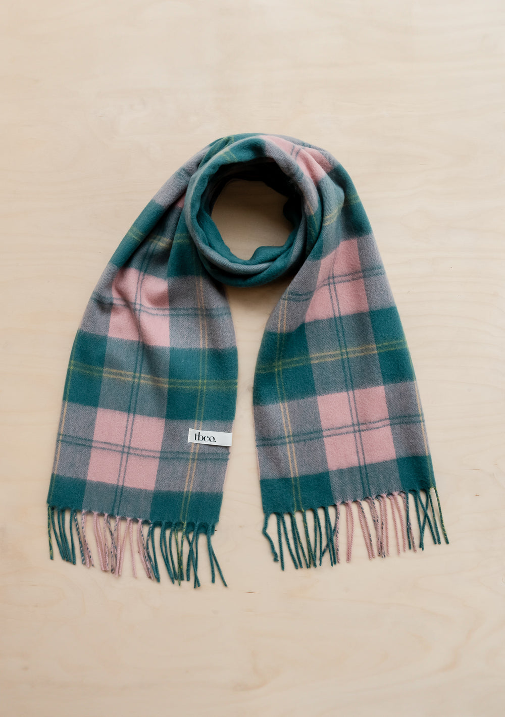 TBCo Lambswool Oversized Scarf in Pink Varsity Check with fringed ends, featuring pink and fir green plaid pattern