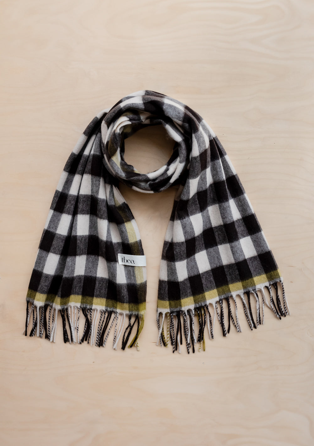 TBCo Monochrome Gingham Lambswool Blanket Scarf in black and white check pattern with lime green accent and fringed ends