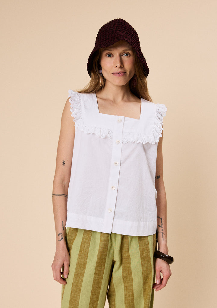 Model wearing TBCo Cotton Broderie Sleeveless Top in White with breathable natural and recycled fibres, Certified B-Corp, Women-Founded, designed to make an impact
