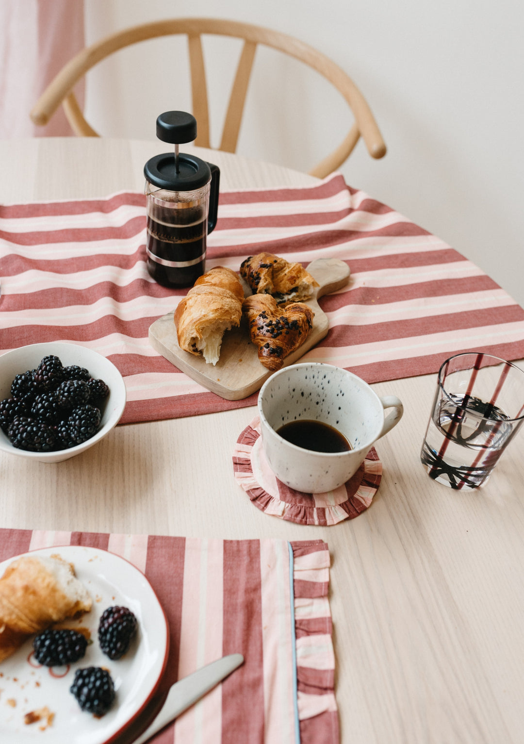 TBCo Tableware Set with red striped linens, featuring French press coffee, pastries and fresh blackberries on wooden table