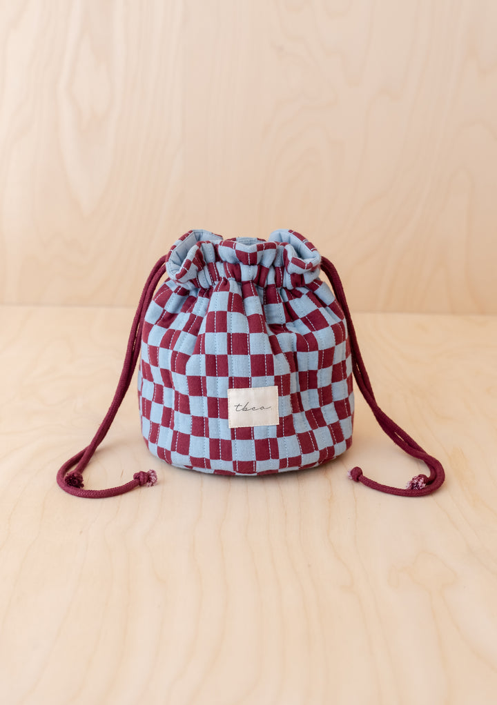 Cotton Wash Bag in Blue Checkerboard by TBCo, structured quilted cotton with drawstring, compact and upright design.