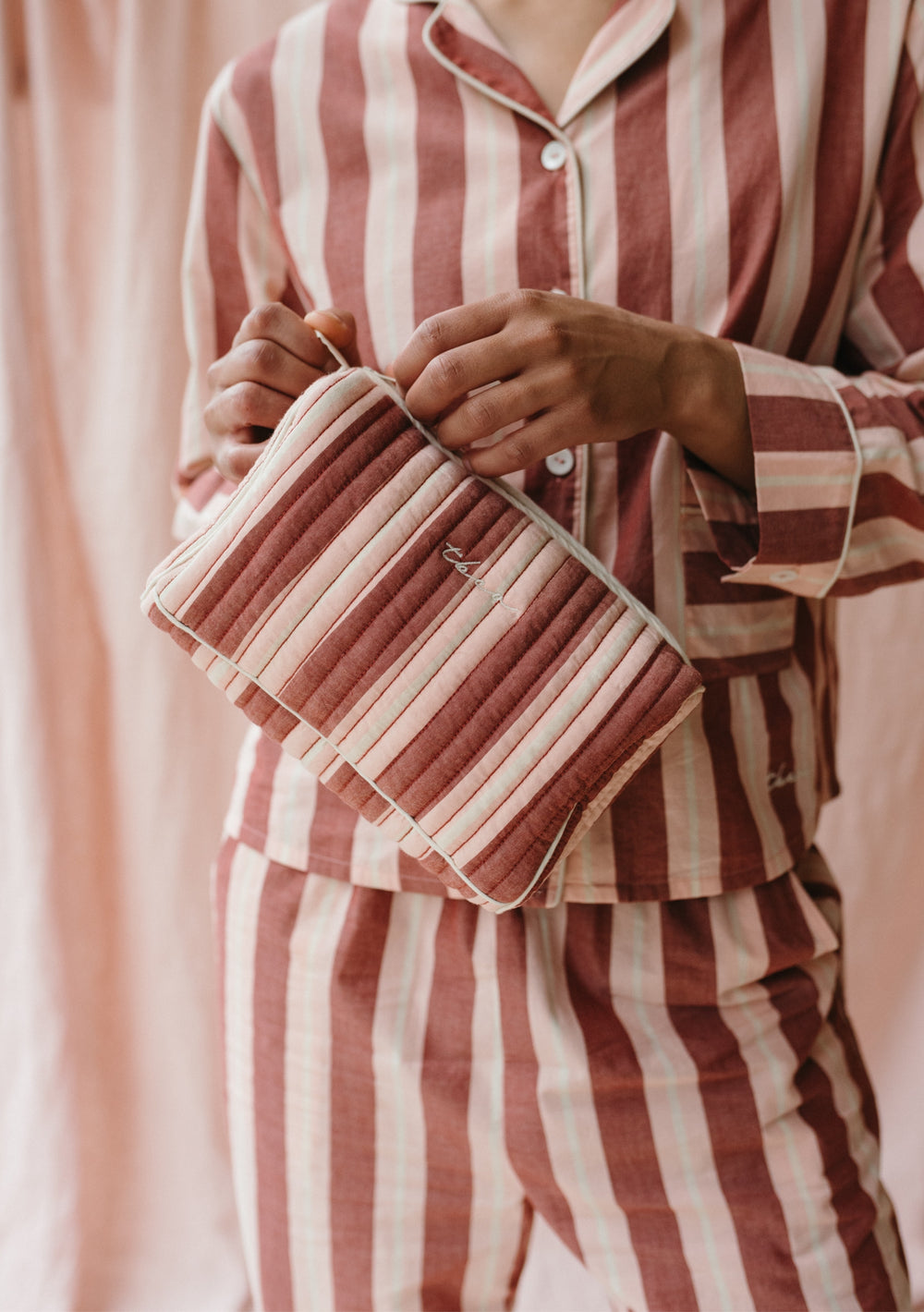 Quilted red and cream striped TBCo Cotton Wash Bag with contrast piping and embroidered logo, matching sleep collection